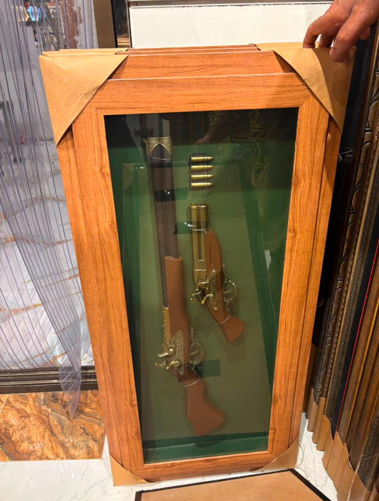vintage flintlock-style musket and pistol